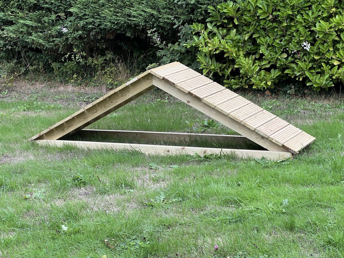 Handcrafted wooden agility ramp and A-frame